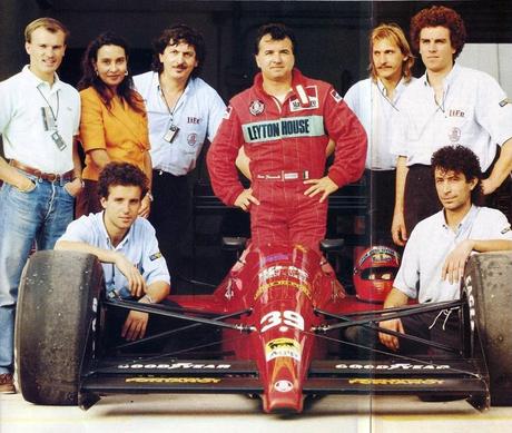 Bruno Giacomelli standing in the Life cockpit, surrounded by team members